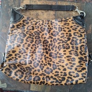 Dooney and Bourke leopard print bag with black patent strap